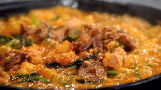Beef large intestines and bulgogi boiling in a pot