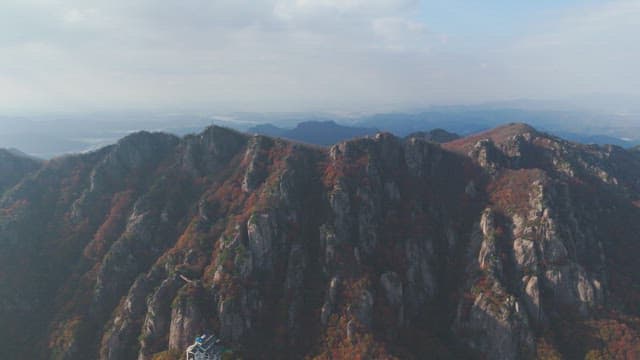 Majestic mountain range with autumn foliage