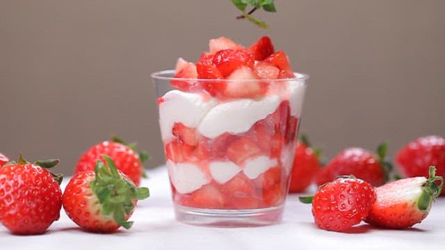 Creamy strawberry dessert with fresh strawberries and mint