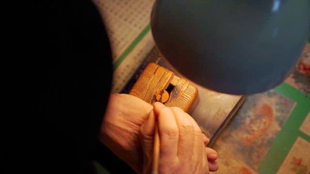 Craftsman Carving Wood Intricately