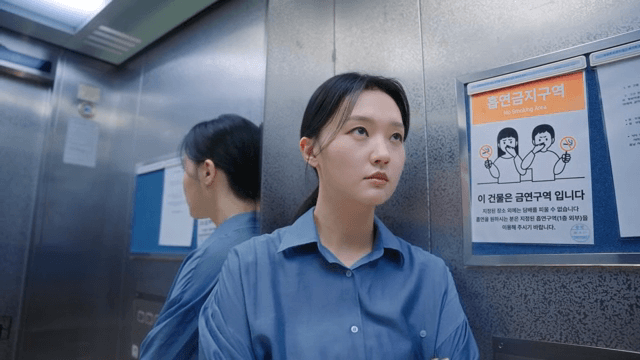 Woman riding an elevator