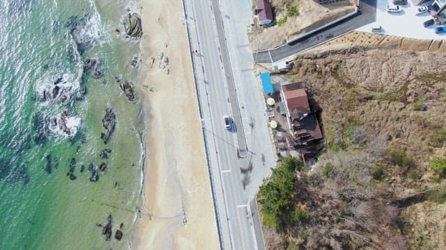 Coastal road with rocky shoreline