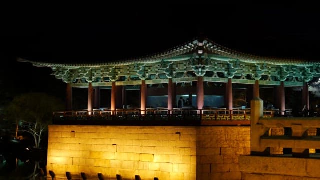 Ancient pavilion illuminated at night