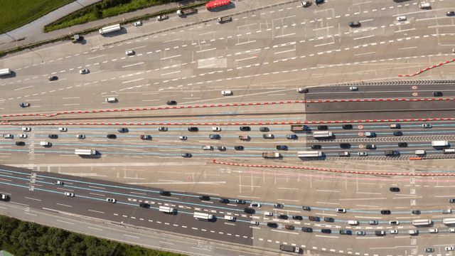 Busy highway with multiple lanes and vehicles
