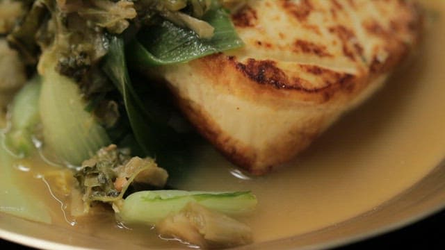 Fermented ​​kimchi and braised tofu neatly plated on a plate