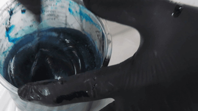 Hand mixing blue pigment