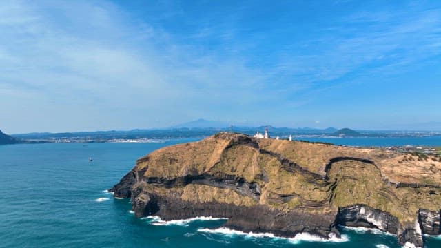 Scenic coastal cliff with a lighthouse