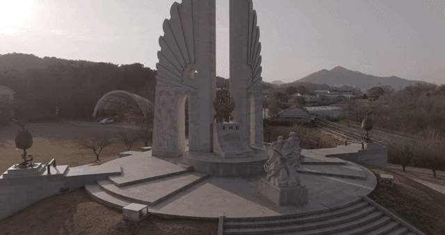 A monument with sculptures in a park