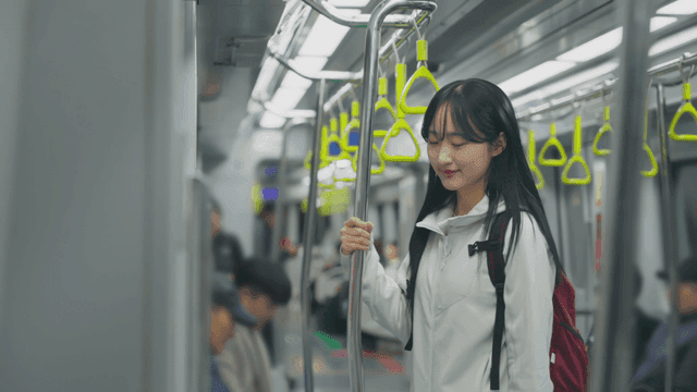 Young woman in subway train