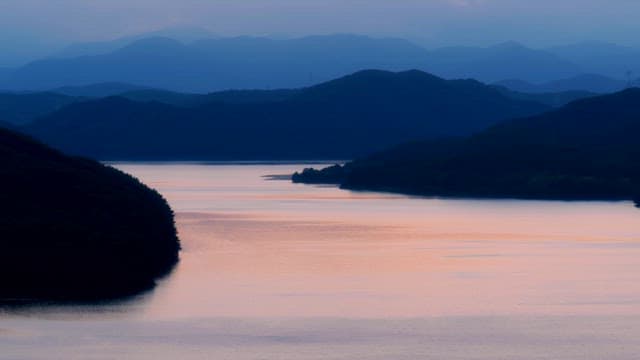 Tranquil lake surrounded by mountains