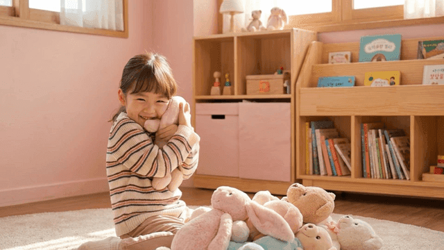 Girl playing with doll in cozy room