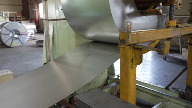 Metal sheet processing in a factory