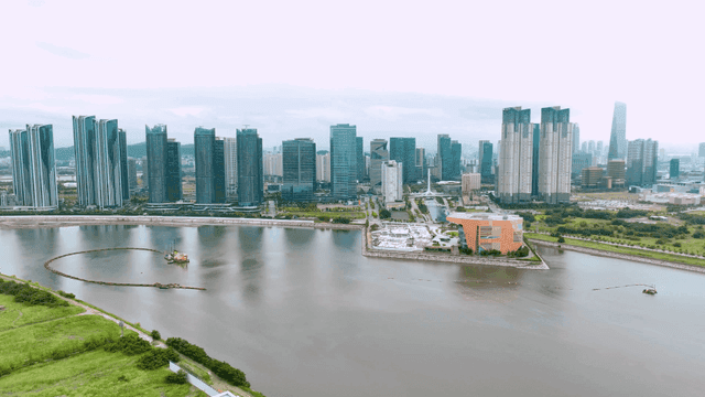 Modern city skyline with river view