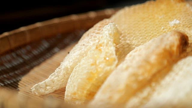 Fresh honeycomb on a wicker tray