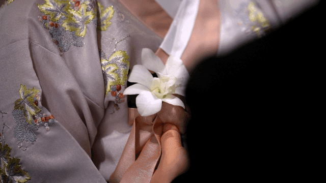 Traditional Korean attire with floral detail