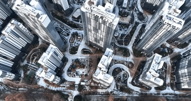 Snow-covered cityscape with tall buildings
