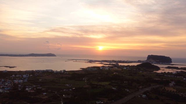 Sunset over a coastal landscape