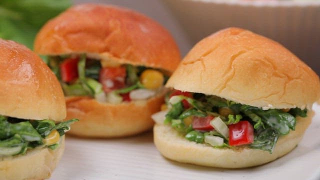 Fresh spring cabbage coleslaw sandwiches on a plate