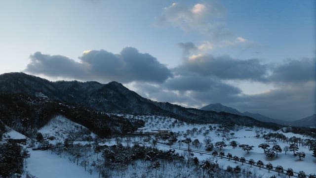 Snowy Mountainous Landscape at Dusk