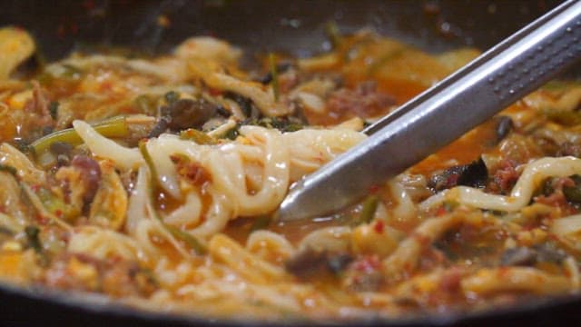 Simmering Hotpot with Steam and Added Noodles