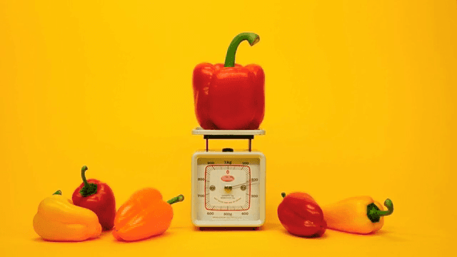 Colorful bell peppers on a scale