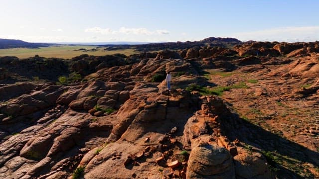 Person standing on rocky mountain