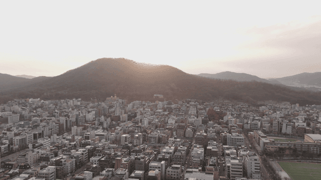 Cityscape with mountains visible at sunset