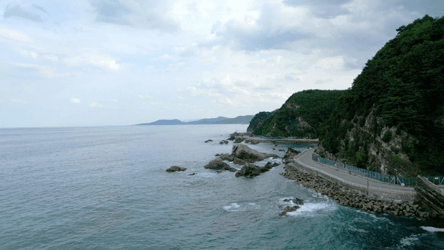 Coastal road with rocky shoreline and ocean