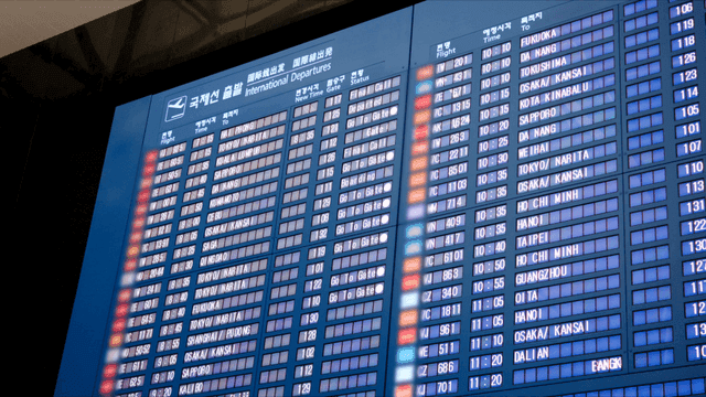 Airport departure board displaying flights