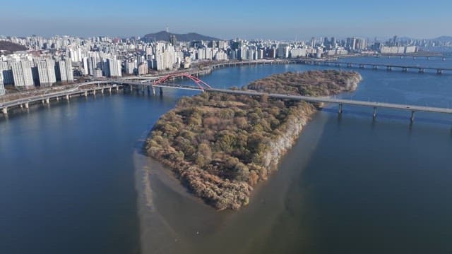 Bamseom Islet under the Bridge in Hangang River and Urban Cityscape