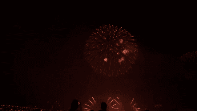 Fireworks display over a city skyline