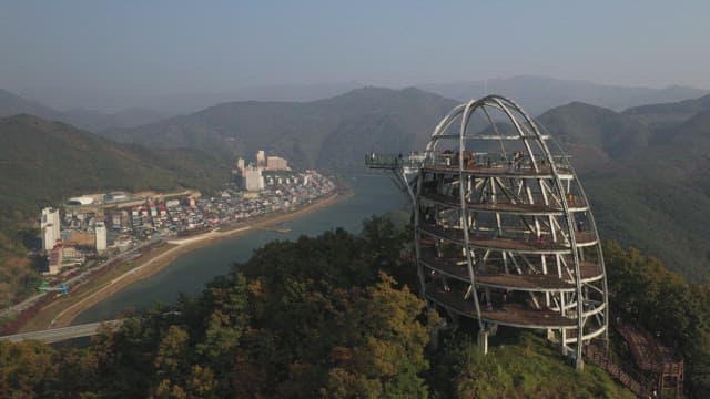 Scenic Skywalk Overlooking a Riverside Village