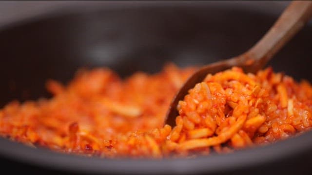 Spoonful of spicy sweet potato salad bibimbap