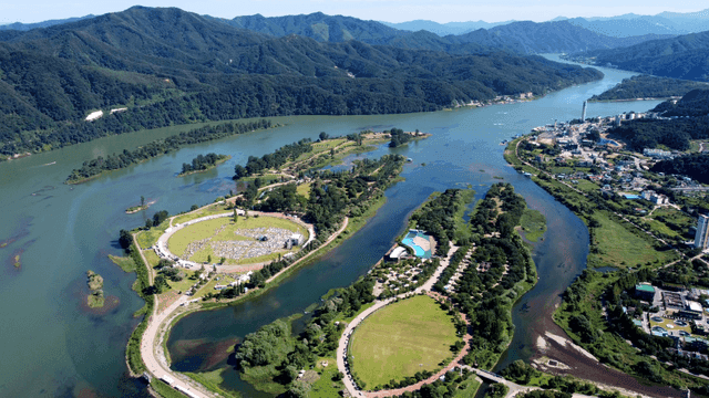 Scenery of river flowing along green mountains