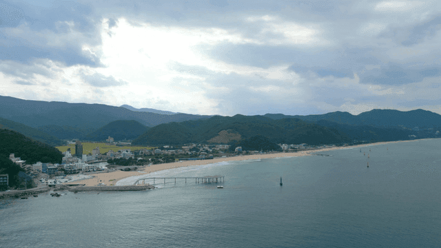 Coastal town with mountains and beach