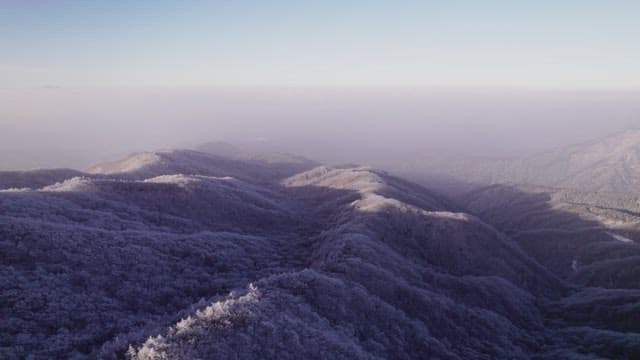 Mountains Covered White with Snow at Dawn