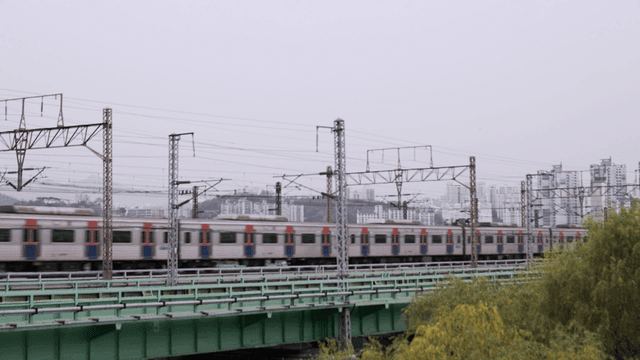 Train passing through city landscape