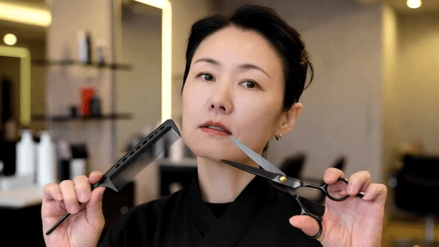 Hairdresser holding scissors