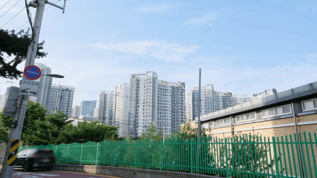 Cityscape with tall apartments and trees