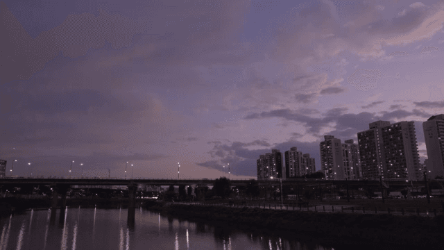 City skyline at dusk with a river view