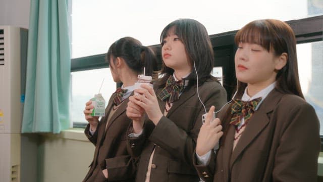 Students taking a break and drinking milk in the classroom