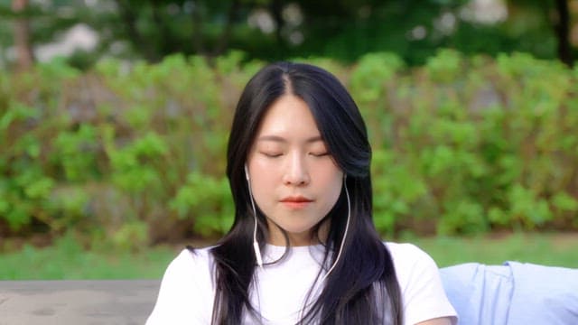 Woman enjoying a peaceful moment outdoors