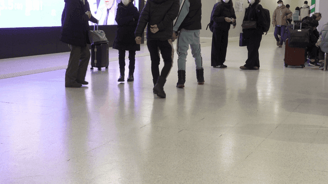 People walking in a busy terminal