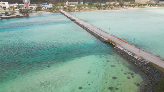 Bridge over clear turquoise sea