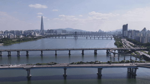 Aerial view of a city with bridges and river
