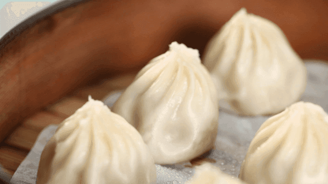 Steamed dumplings in a bamboo steamer
