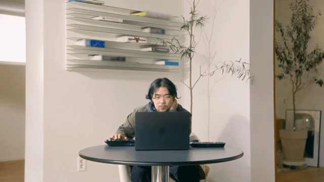 Man working on a laptop indoors