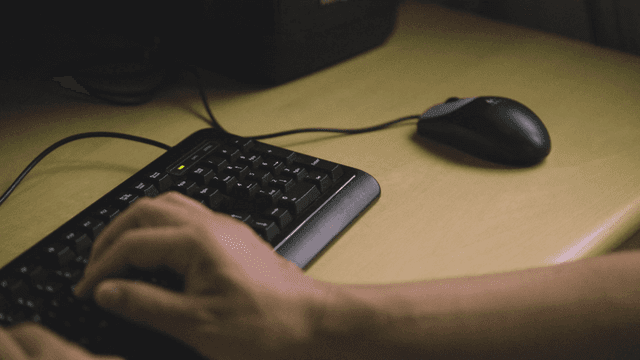 Hands typing on keyboard