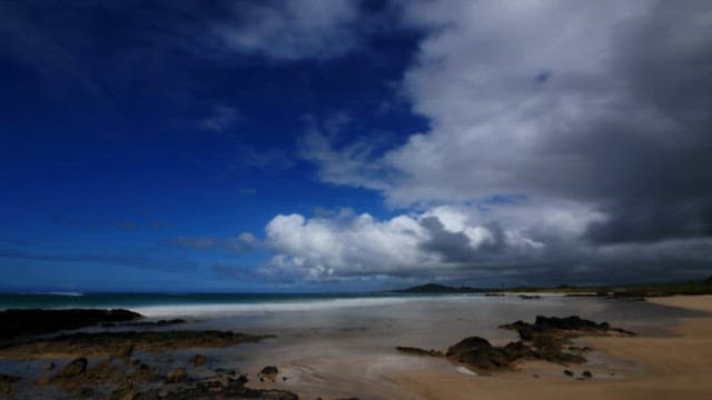 Serene Beachscape with Dynamic Clouds