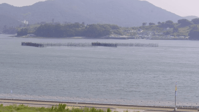 Coastal view with fish farm structures